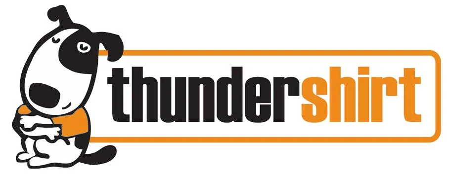 Cartoon dog beside thundershirt logo.