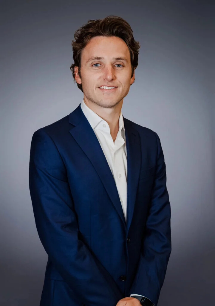 Man in blue suit portrait.