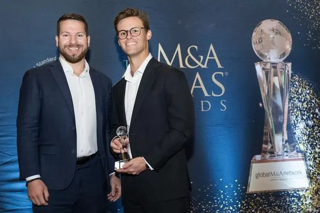 Luke and Stanley at the 2026 Atlas Awards holding trophy